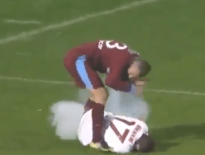 A smoke bomb explodes near the two players