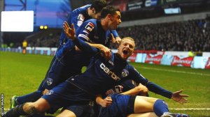 Oldham players celebrate their famous victory (Image from Getty)