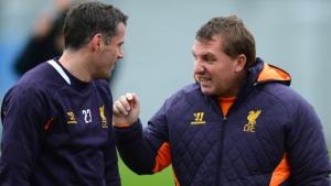 Carragher and Rodgers talk during a training session (Image from PA)