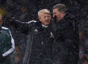 Back to the drawing board for Strachan and assistant McGhee (Image from Reuters/David Moir )