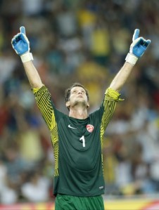 Tahiti goalkeeper Xavier Samin celebrates as Spain hit the bar  (Image from Getty)
