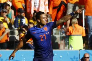 Memphis Depay set up and score a goal in Holland's 3-2 win over Australia (Image from Getty)