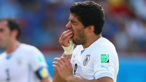Hero to Villan - Suarez bites again (Image from Getty)