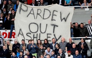 Pardew out banners displayed at recent matches by the fans  (Image from AFP)