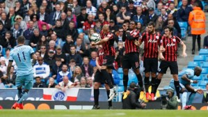 Kolarov curls one over a badly organized QPR wall  (Image from Getty