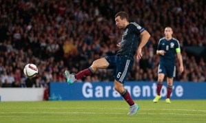 McArthur delivers a warning blow to the Germans which puts Scotland back in the fight (Image from PA)