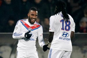 Alexandre Lacazette and Bafetimbi Gomis were transformed by Garde at Lyon (Image from AFP)