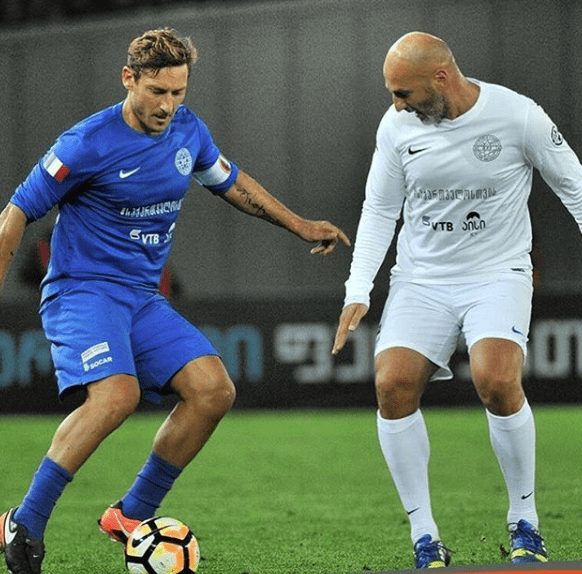 Zurab playing for a Georgia select side vs a World X1 featuring Francesco Totti (Image from Zurab's Instagram)