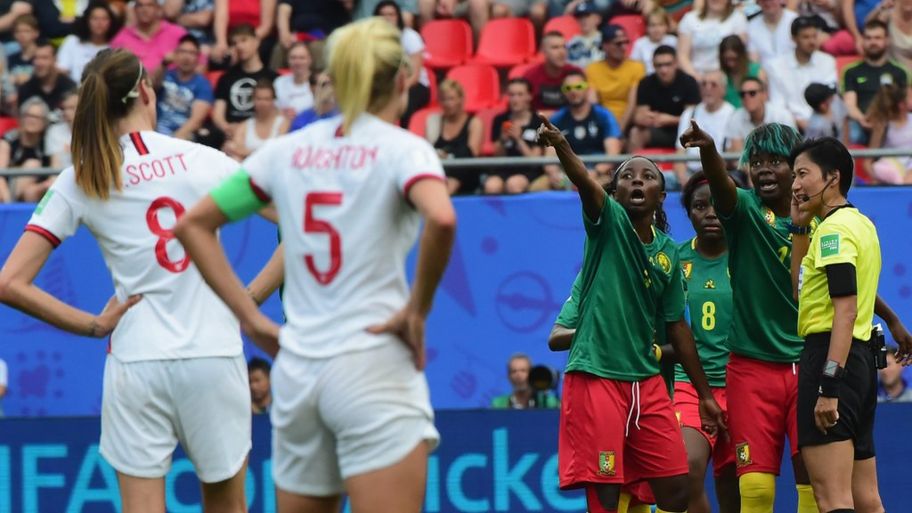Cameroon players plead with the referee to look at the video board for a VAR call during the Womens World Cup (Image from Tumblr)